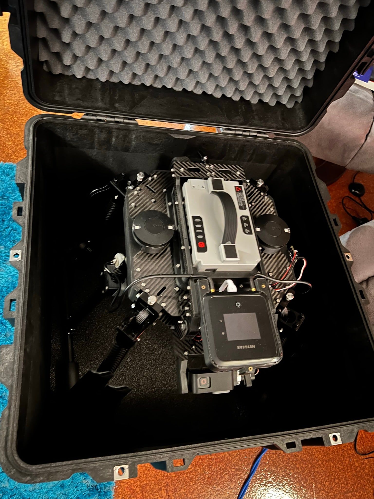 A drone system packed into a foam-lined hard case